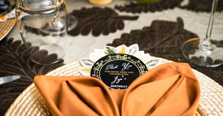 Elegantly set birthday dinner table at home with glassware and decorative birthday decor for an adult celebration