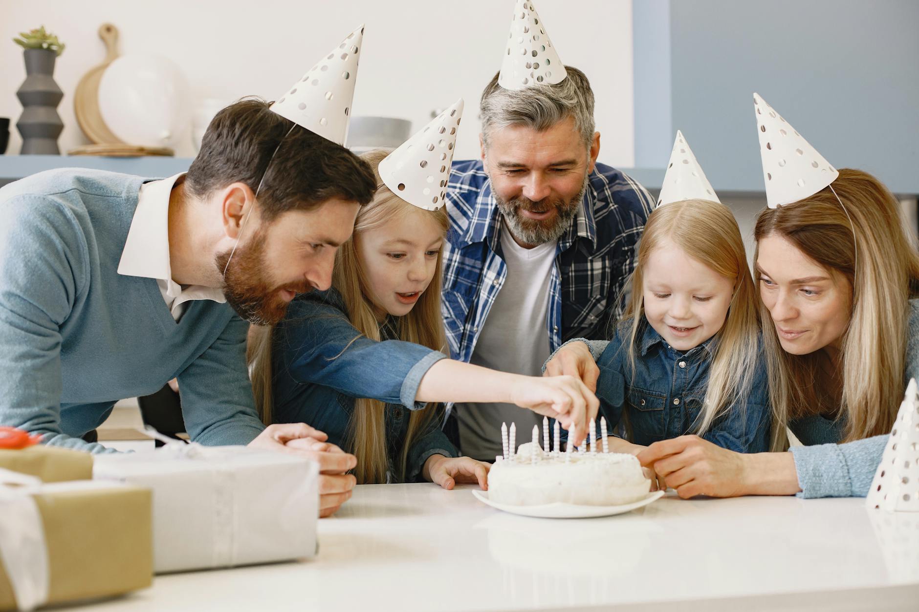 Family gathering around birthday cake with children and parents , birthday celebrations strengthen family bonds