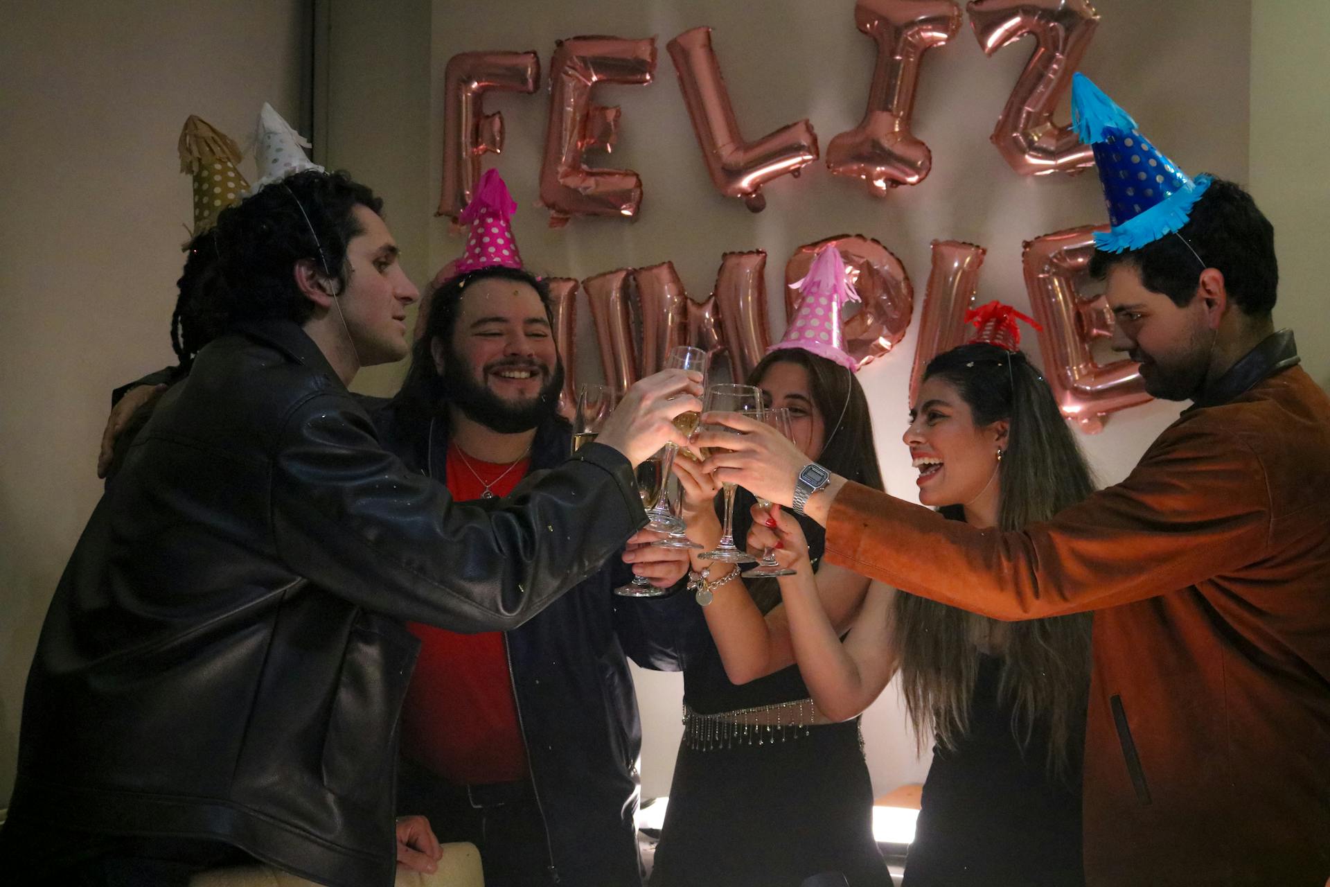 Friends toasting with champagne at a 30th birthday party celebration